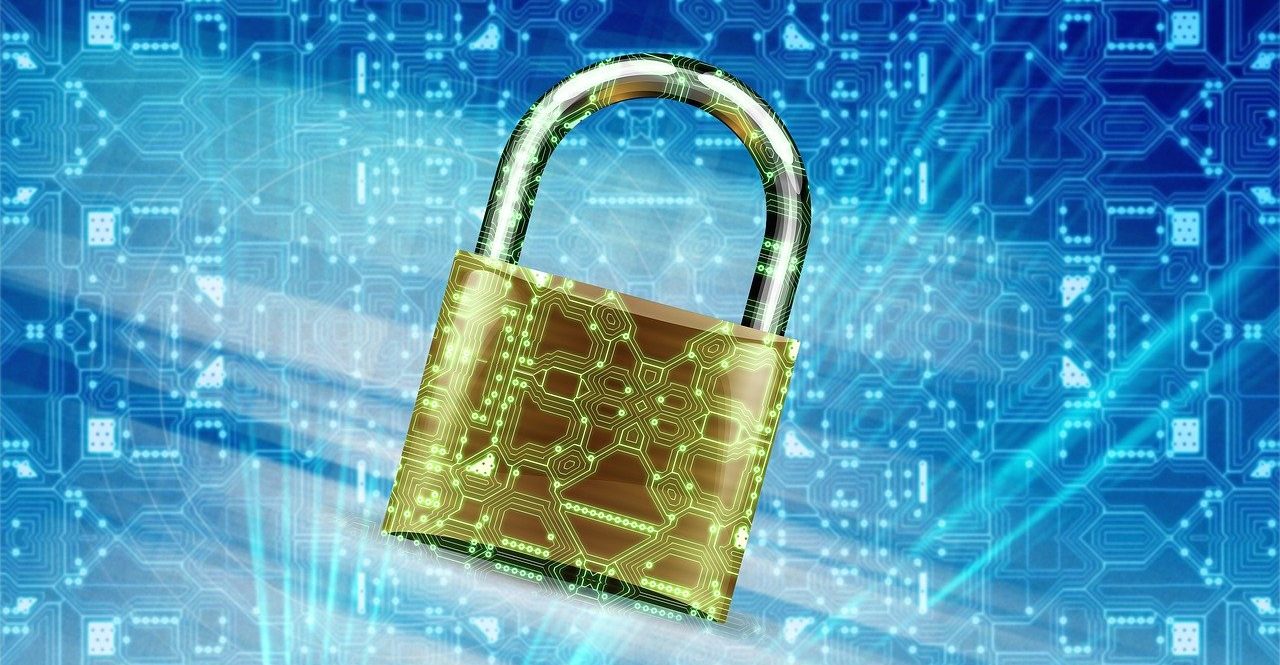 A golden padlock with a circuit board design superimposed on a blue digital background, symbolizing layered security in cybersecurity.