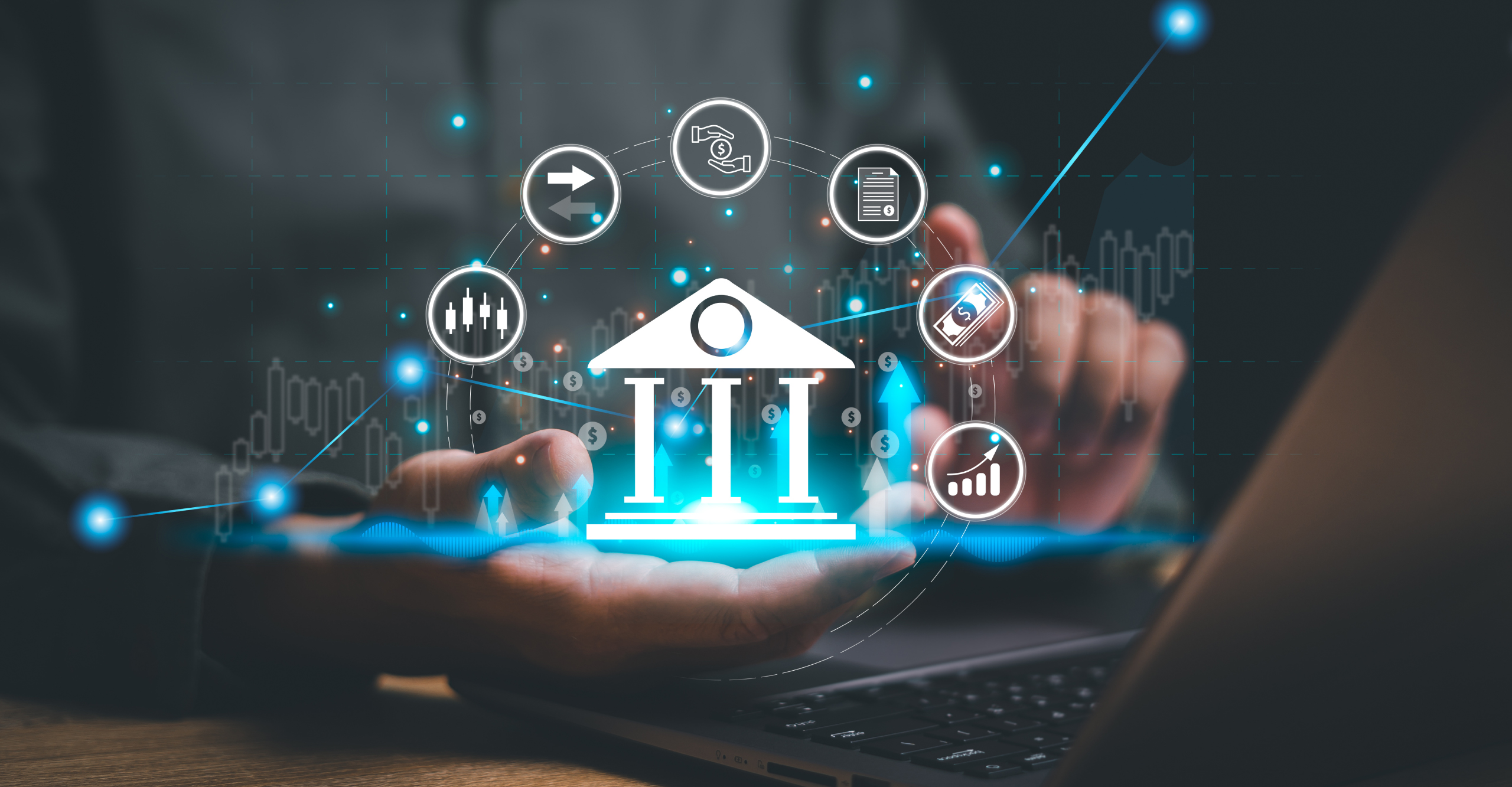 Person using laptop with a holographic image of a bank icon surrounded by business, financial, and technology symbols, representing online banking or fintech services integrated with systems hardening for enhanced security.